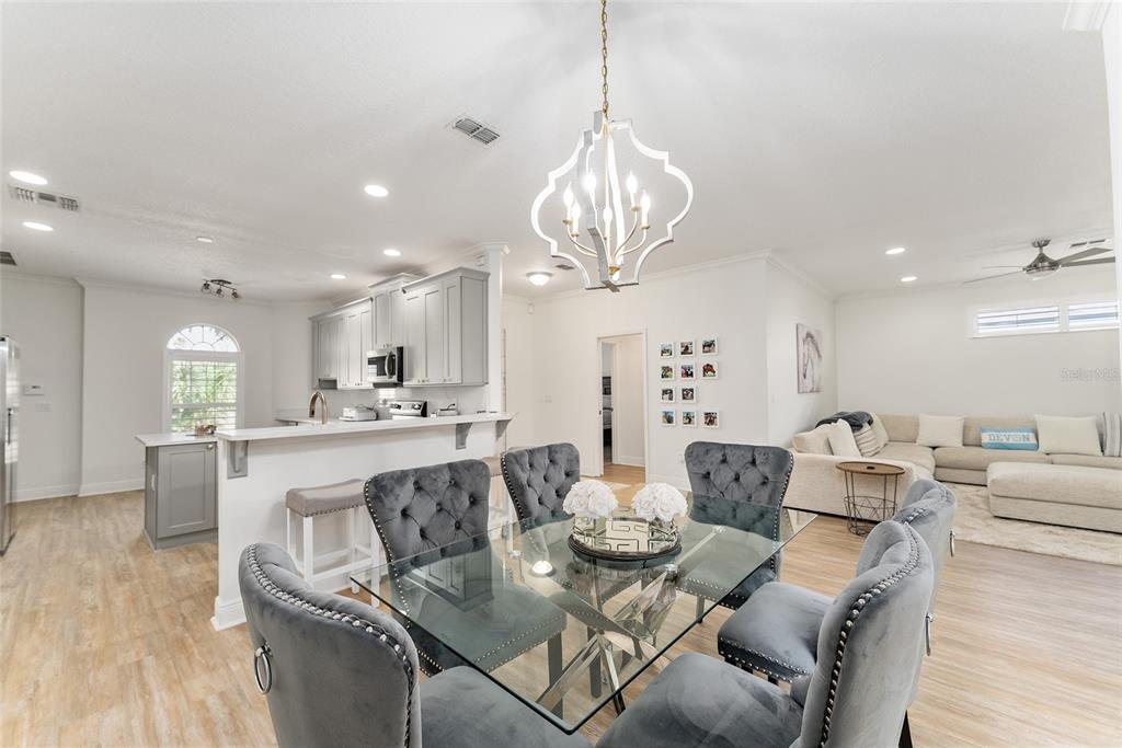 4987 Southwest 63rd Loop Ocala, FL 34474 - Photo 17 of 56 a large kitchen with a table and chairs