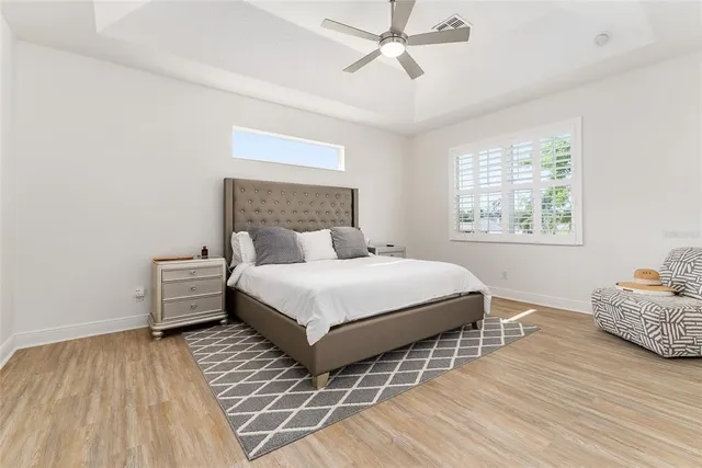 a bedroom with a bed and a television