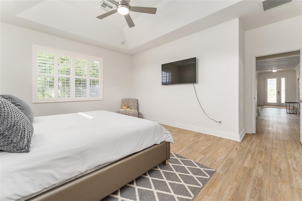 4987 Southwest 63rd Loop Ocala, FL 34474 - Photo 29 of 56 a bedroom with a bed and a window