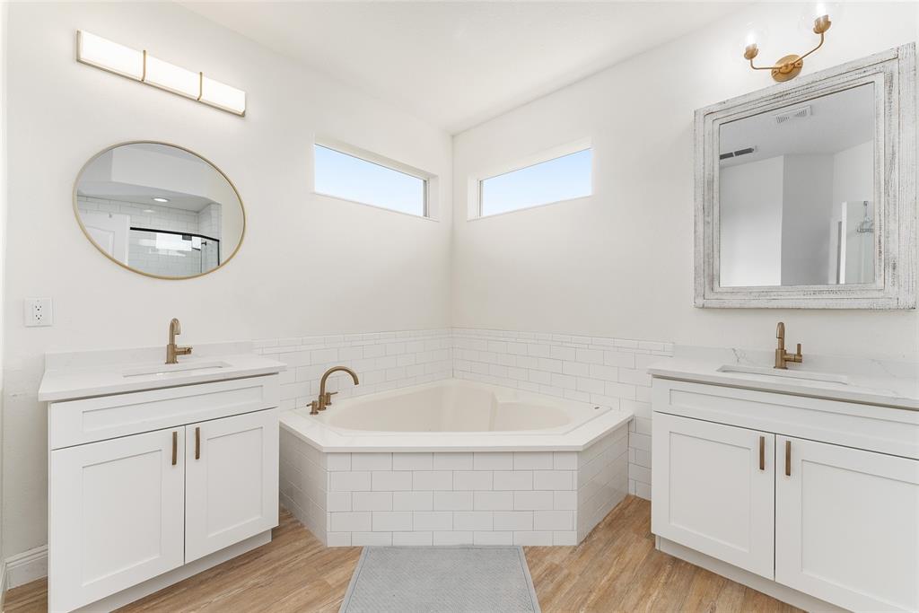 4987 Southwest 63rd Loop Ocala, FL 34474 - Photo 33 of 56 a bathroom with a sink and a mirror