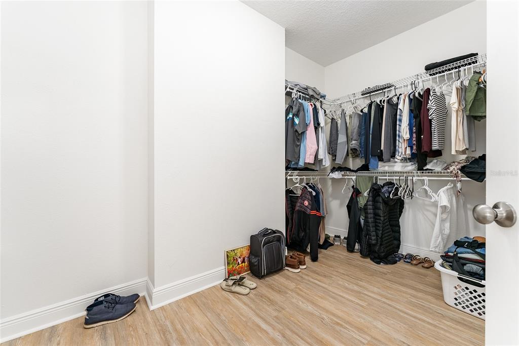 4987 Southwest 63rd Loop Ocala, FL 34474 - Photo 38 of 56 a view of walk in closet with clothes and shoes