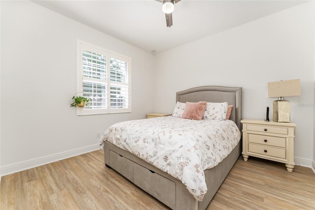 4987 Southwest 63rd Loop Ocala, FL 34474 - Photo 39 of 56 a bedroom with a bed and a window