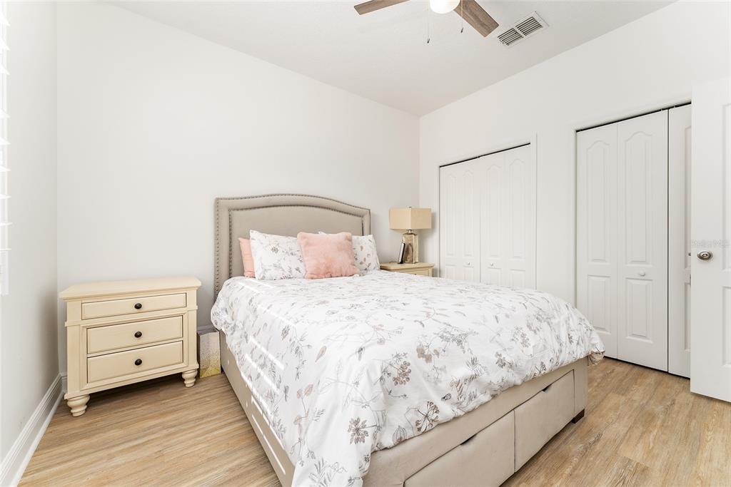 4987 Southwest 63rd Loop Ocala, FL 34474 - Photo 40 of 56 a bedroom with a bed and a dresser