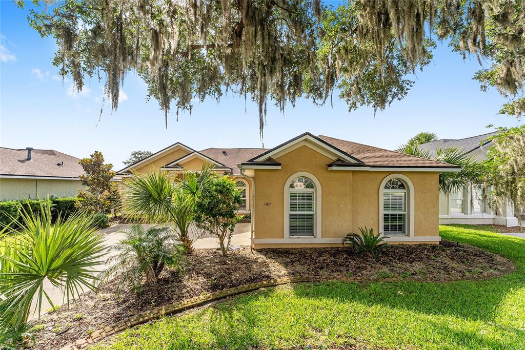 4987 Southwest 63rd Loop Ocala, FL 34474 - Photo 4 of 56 a view of a front of house with a yard