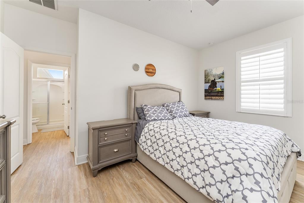 4987 Southwest 63rd Loop Ocala, FL 34474 - Photo 42 of 56 a bedroom with a bed and a dresser