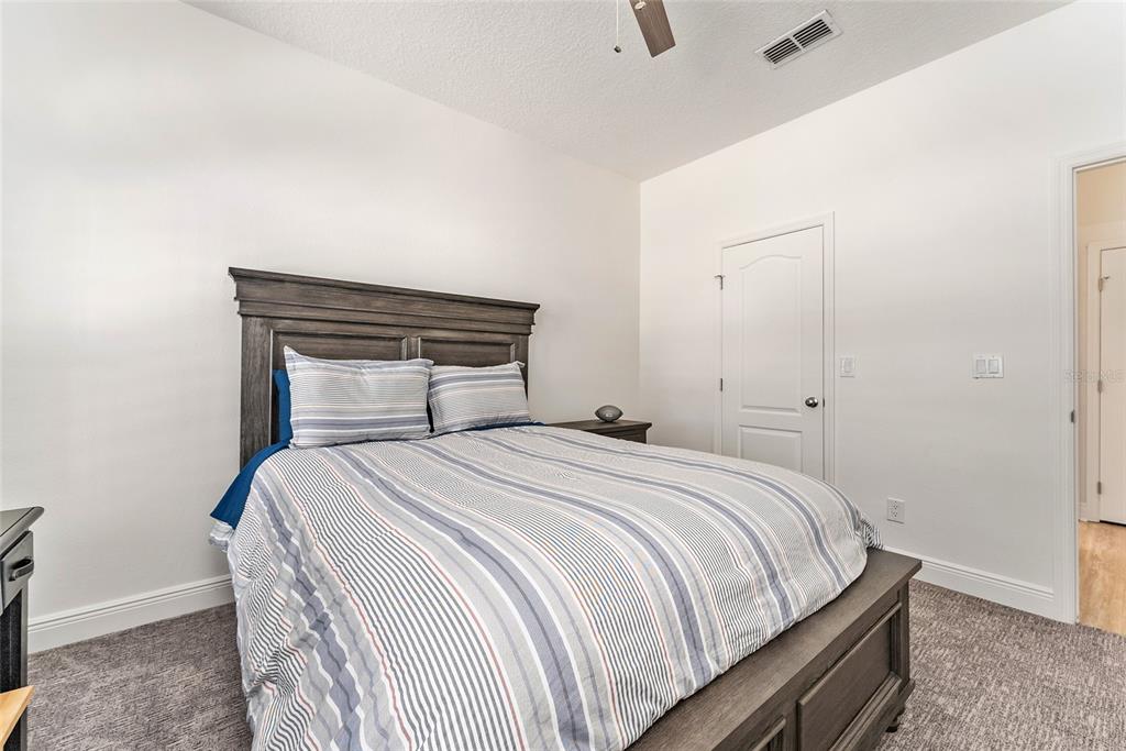 4987 Southwest 63rd Loop Ocala, FL 34474 - Photo 46 of 56 a bedroom with a bed and a window