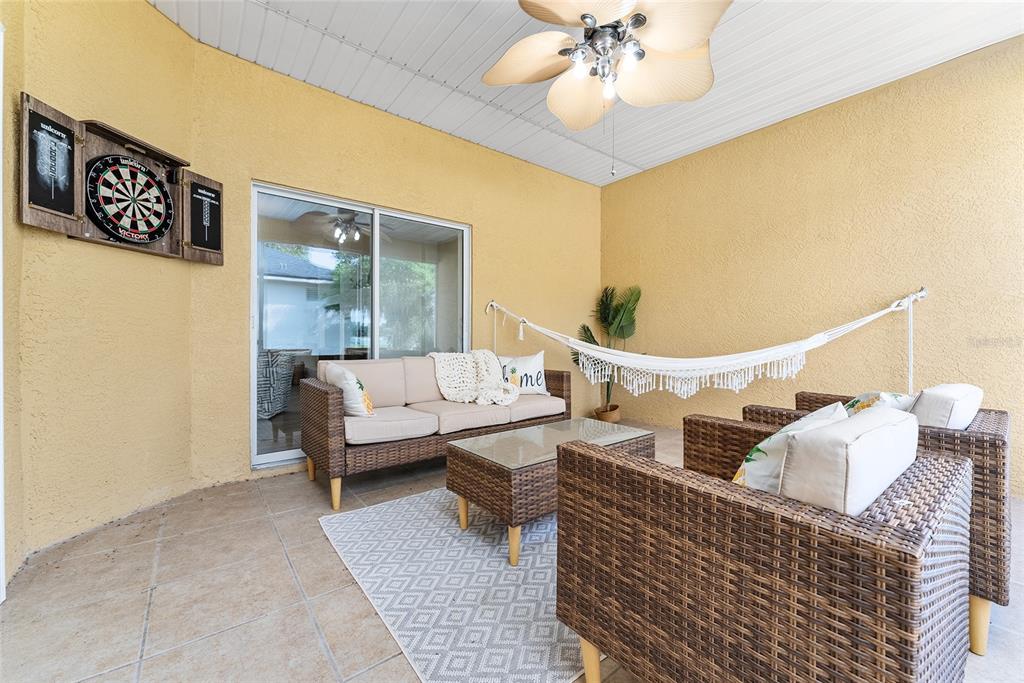 4987 Southwest 63rd Loop Ocala, FL 34474 - Photo 50 of 56 a living room with furniture and a chandelier
