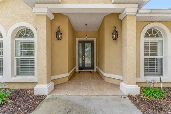 a front view of a house with a glass door
