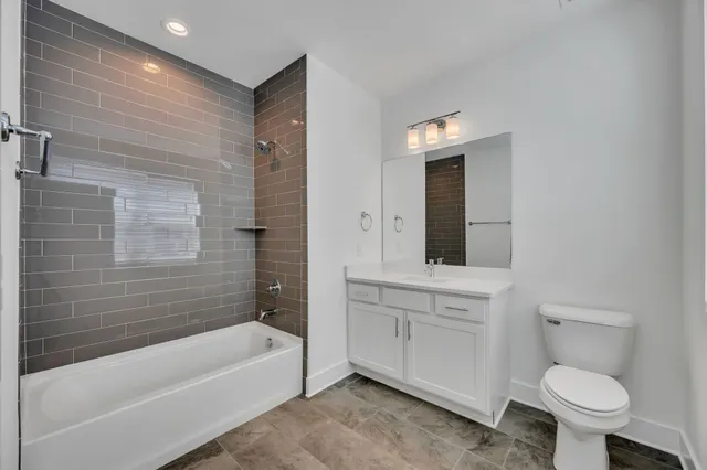a bathroom with a sink toilet and bathtub