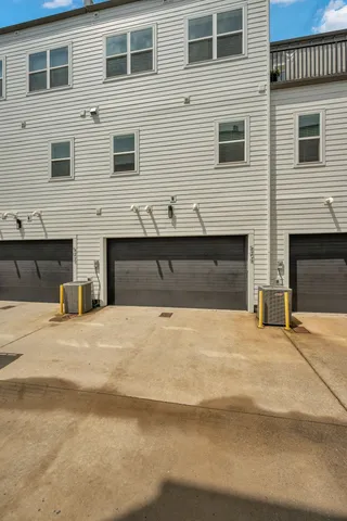 a view of a house with a yard and garage