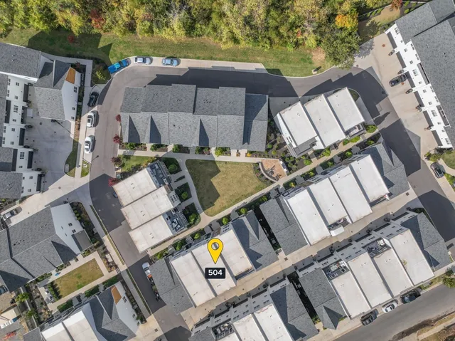 a view of a patio with table and chairs with wooden floor and fence