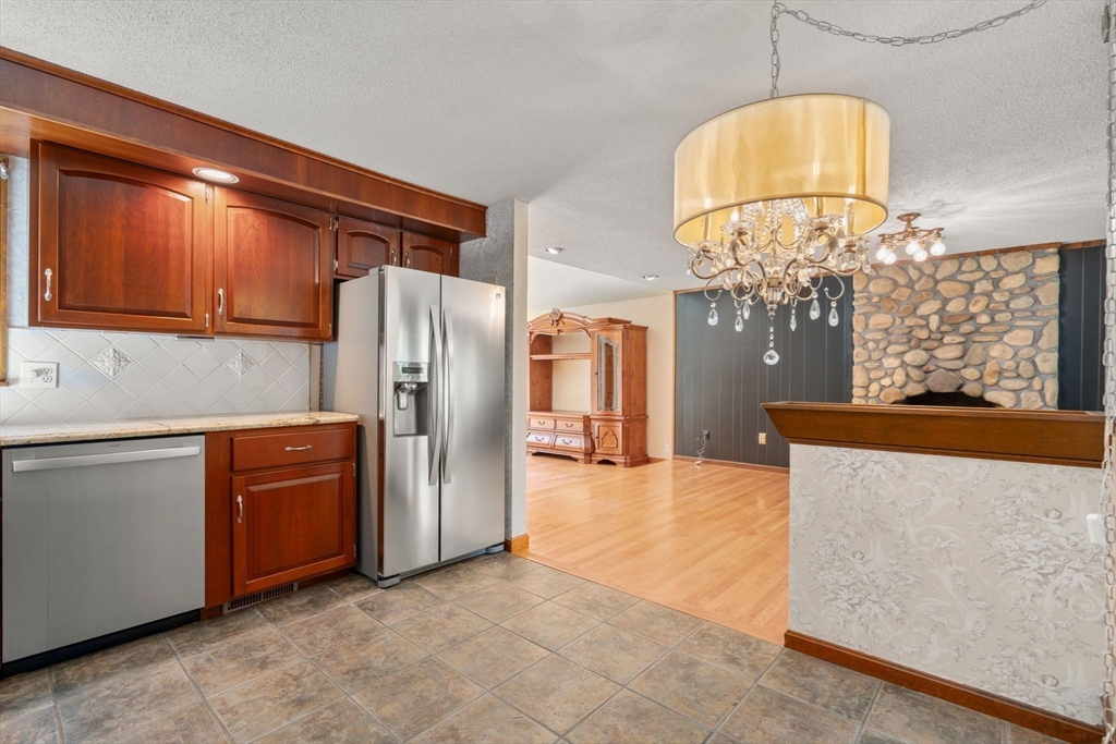 2035 Parker Street Springfield, MA 01128 - Photo 14 of 42 a kitchen with stainless steel appliances a refrigerator and stove