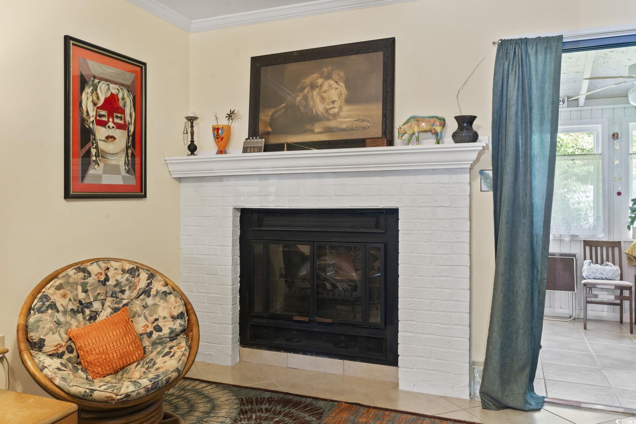 55 Beaver Pond Loop, Unit 15 Pawleys Island, SC 29585 - Photo 11 of 24 Detailed view of a fireplace and ornamental molding