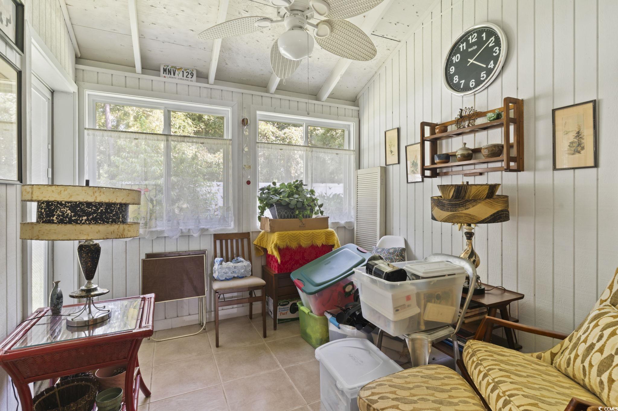 55 Beaver Pond Loop, Unit 15 Pawleys Island, SC 29585 - Photo 13 of 24 Sunroom / solarium featuring tile patterned floors and wooden walls