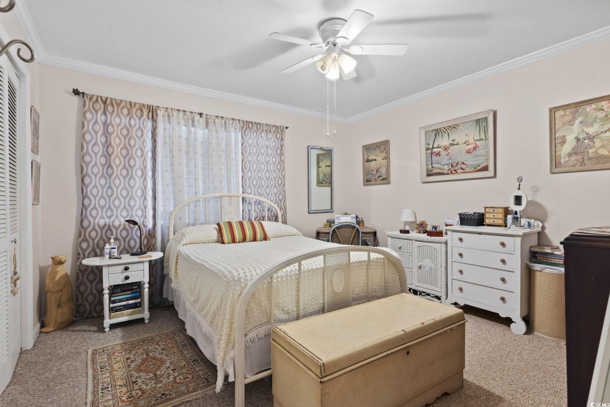 55 Beaver Pond Loop, Unit 15 Pawleys Island, SC 29585 - Photo 15 of 24 Bedroom with carpet floors, ornamental molding, and ceiling fan