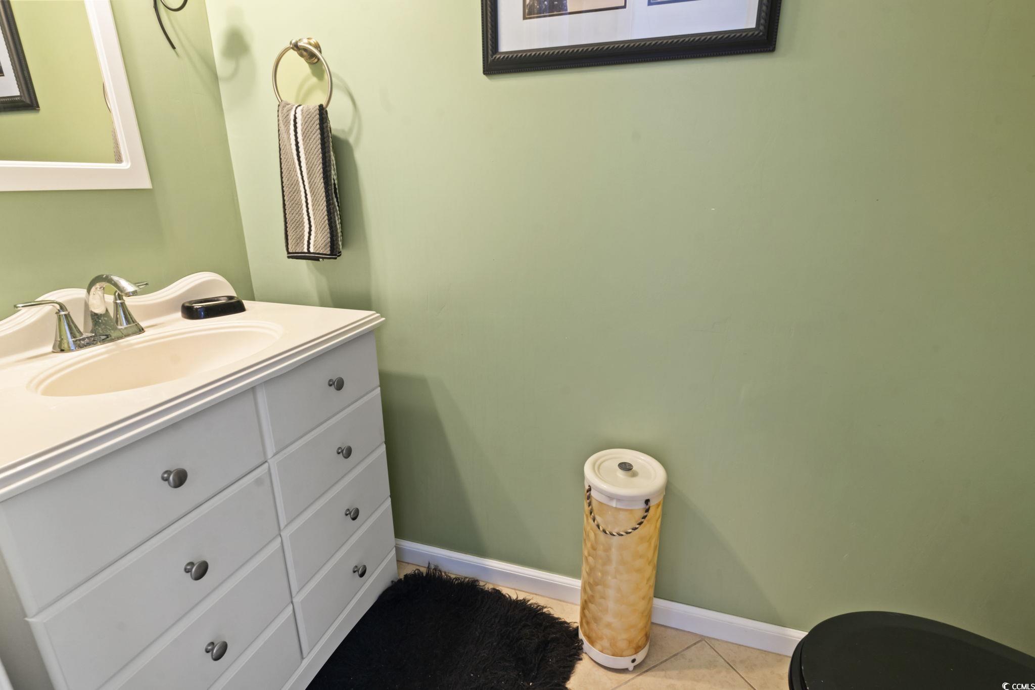 55 Beaver Pond Loop, Unit 15 Pawleys Island, SC 29585 - Photo 20 of 24 Bathroom featuring vanity and light tile patterned floors