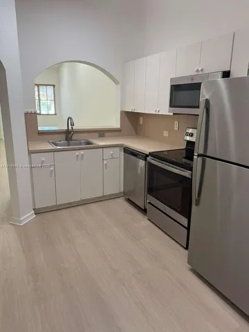 a view of a bathroom with a toilet