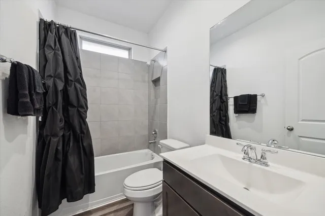 a living room with furniture a rug and a window