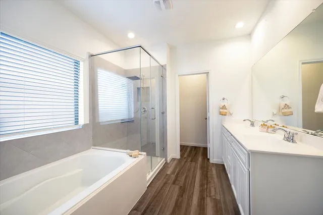 a spacious bedroom with a bed and furniture