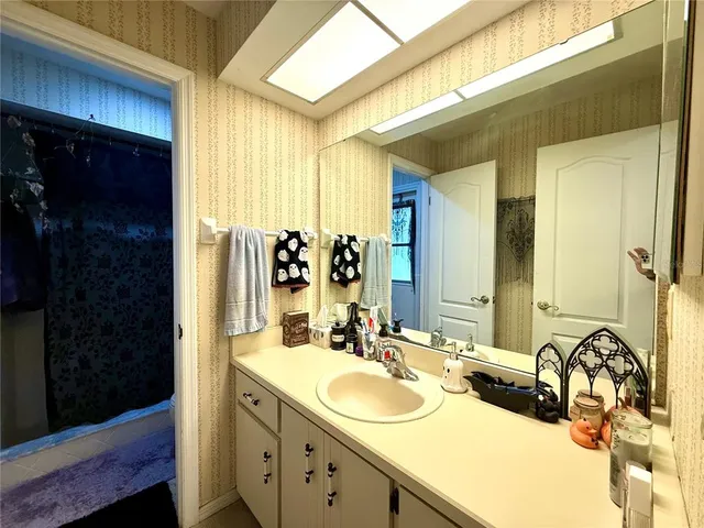 a bathroom with a toilet and shower