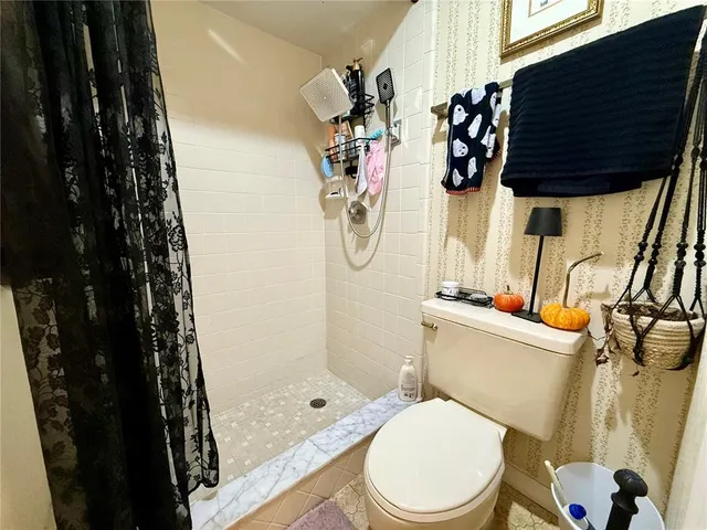 a room with lots of stuff and hardwood floor