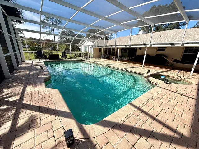 a view of outdoor space with swimming pool