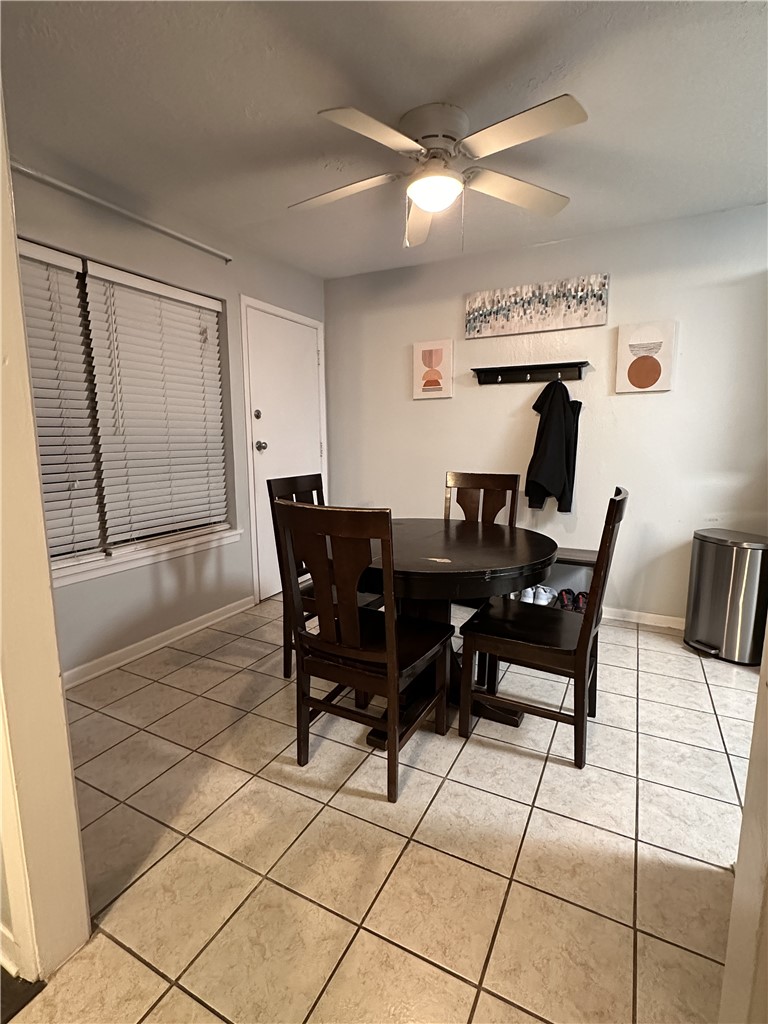 3820 Plainsman Lane Bryan, TX 77802 - Photo 13 of 20 a view of a dining room with furniture and chandelier