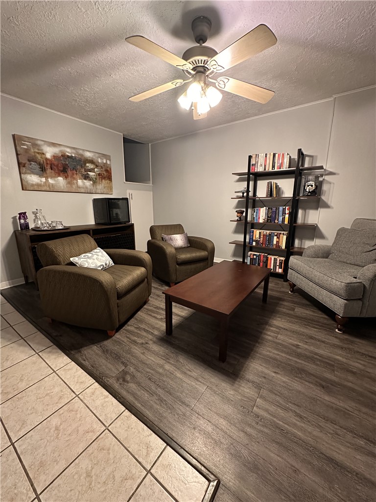 3820 Plainsman Lane Bryan, TX 77802 - Photo 14 of 20 a living room with furniture and a chandelier