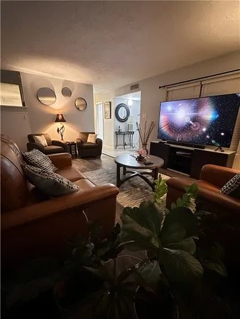 a room with furniture and screen