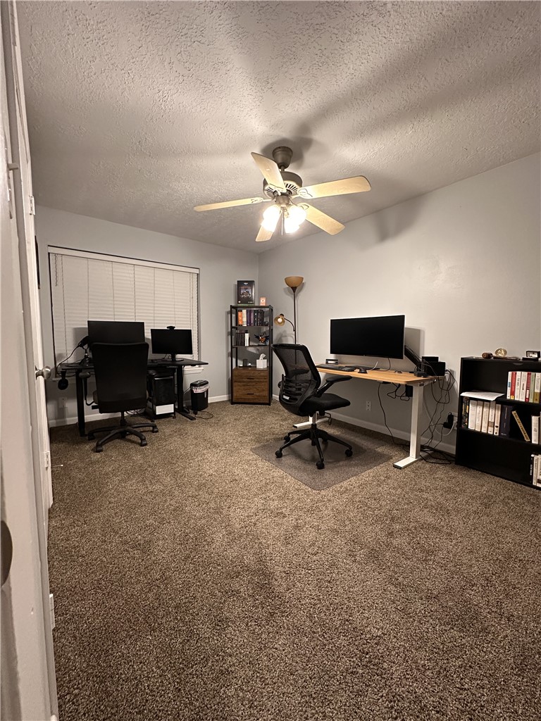 3820 Plainsman Lane Bryan, TX 77802 - Photo 8 of 20 a view of a workspace with furniture and a gym