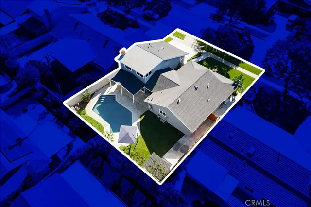 a view of house with yard street and trees in the background