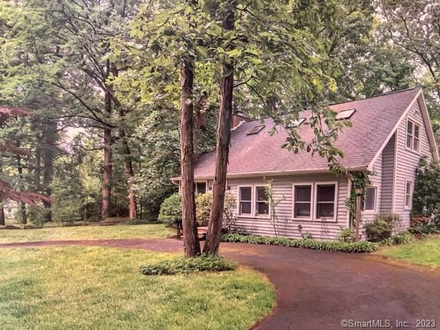 46 Woodland Road Guilford, CT 06437 - Photo 1 of 1 a front view of a house with a yard