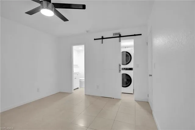 a bathroom with a walk in closet and mirror