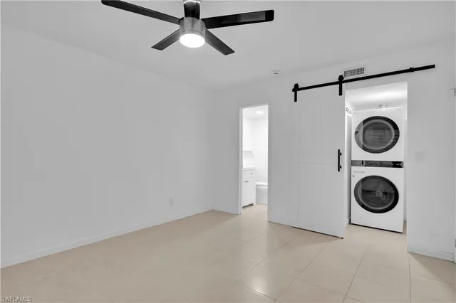 a view of a storage & utility room with a washer dryer