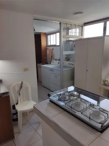 a living room with furniture and window