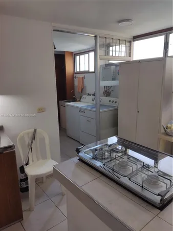 a living room with furniture and window