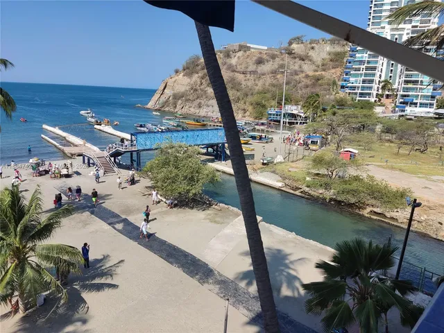 a view of a balcony with chairs