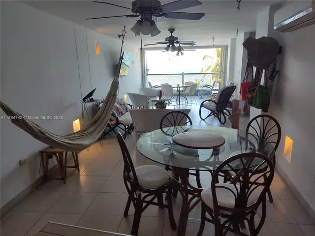 a view of a dining room with furniture and window