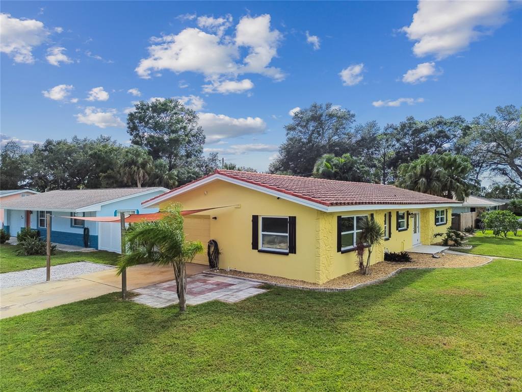 623 Palm Boulevard Dunedin, FL 34698 - Photo 29 of 55 a view of a house with a swimming pool