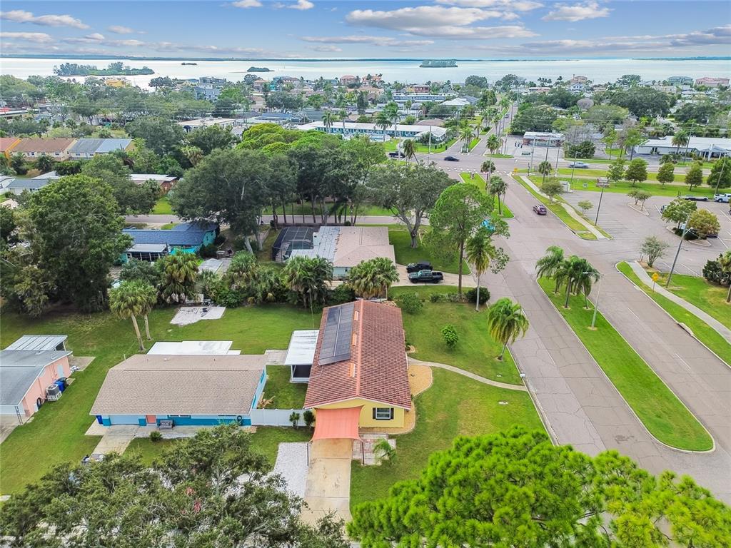 623 Palm Boulevard Dunedin, FL 34698 - Photo 31 of 55 an aerial view of a house with a garden and lake view