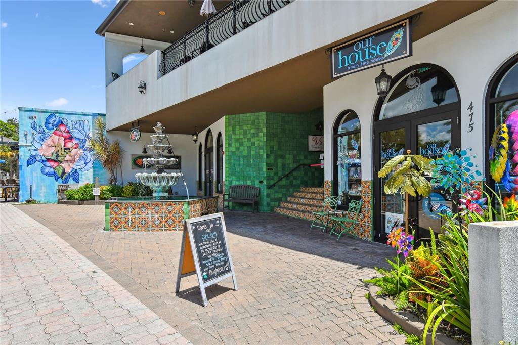 623 Palm Boulevard Dunedin, FL 34698 - Photo 50 of 55 a front view of a building with garden