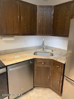 a kitchen with a sink and cabinets