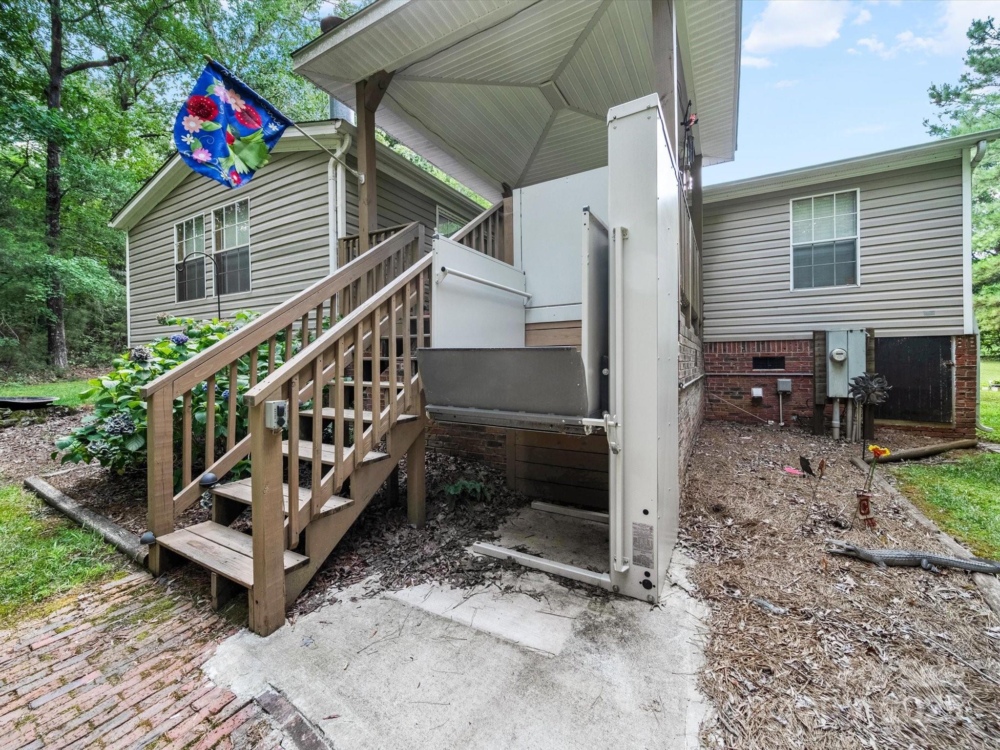 3911 Doster Road Monroe, NC 28112 - Photo 13 of 34 a view of a house with a yard and a deck