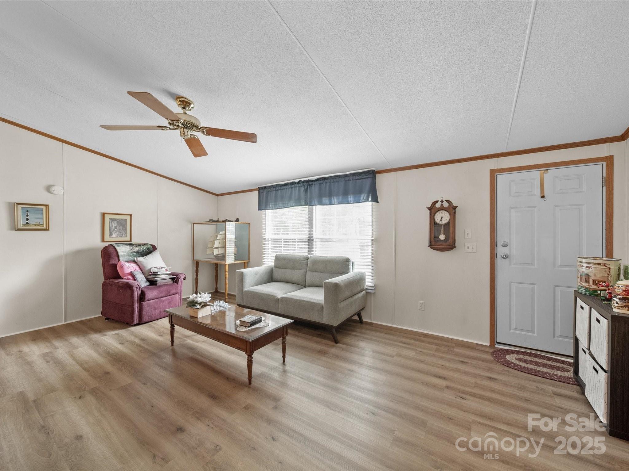 3911 Doster Road Monroe, NC 28112 - Photo 16 of 34 a living room with furniture and wooden floor