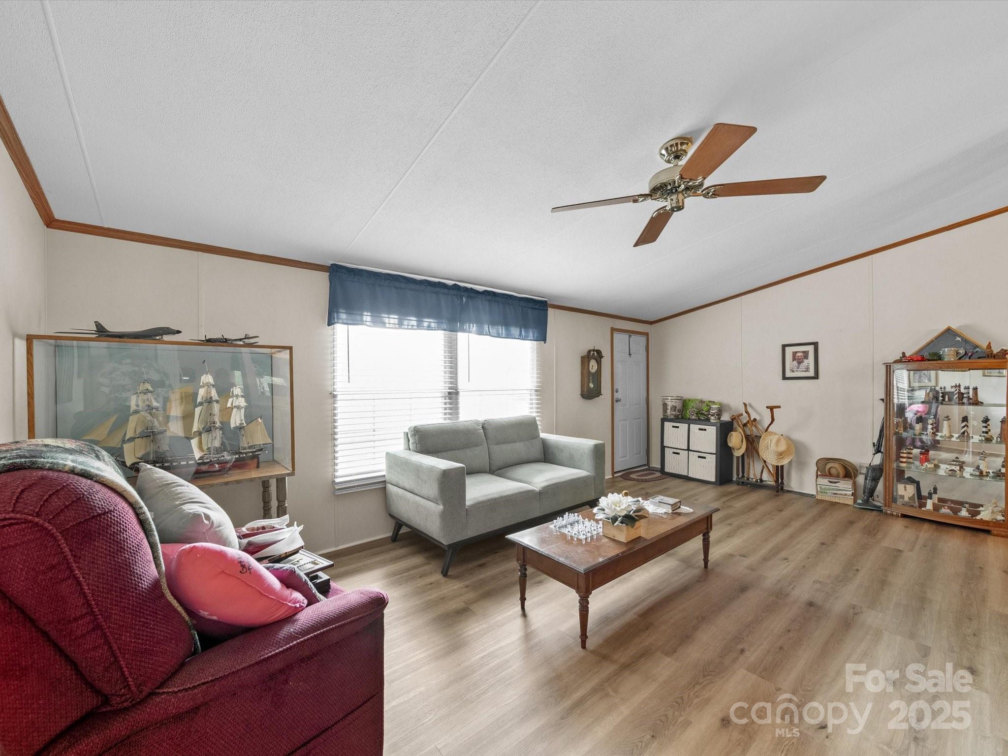 3911 Doster Road Monroe, NC 28112 - Photo 17 of 34 a living room with furniture and wooden floor
