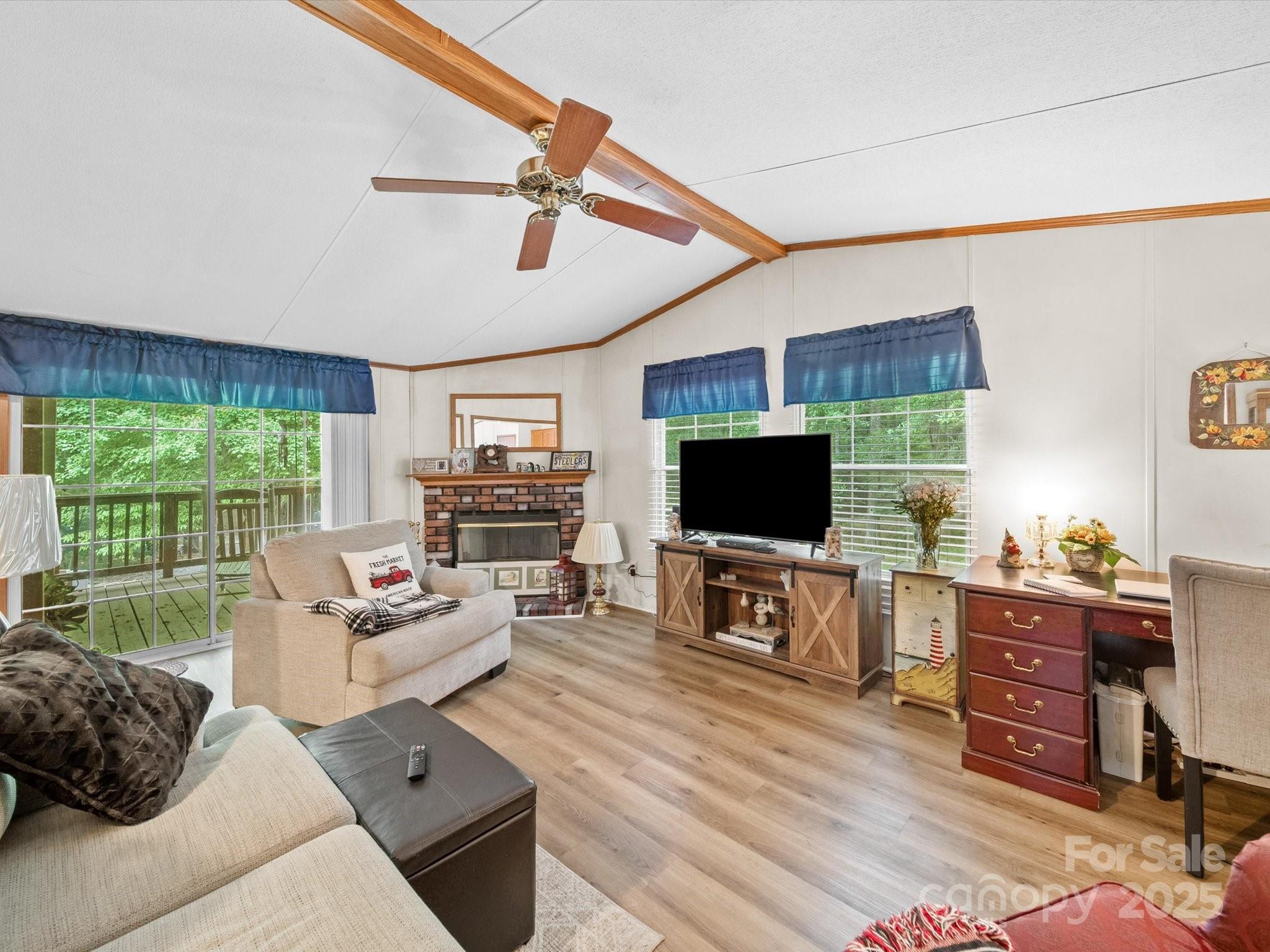 3911 Doster Road Monroe, NC 28112 - Photo 21 of 34 a living room with furniture and a flat screen tv