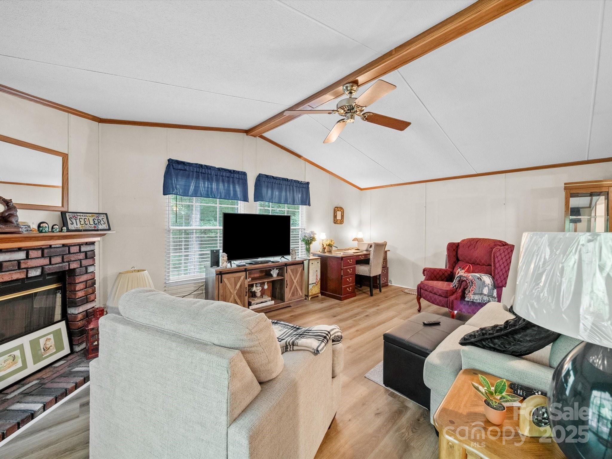 3911 Doster Road Monroe, NC 28112 - Photo 22 of 34 a living room with furniture and a flat screen tv