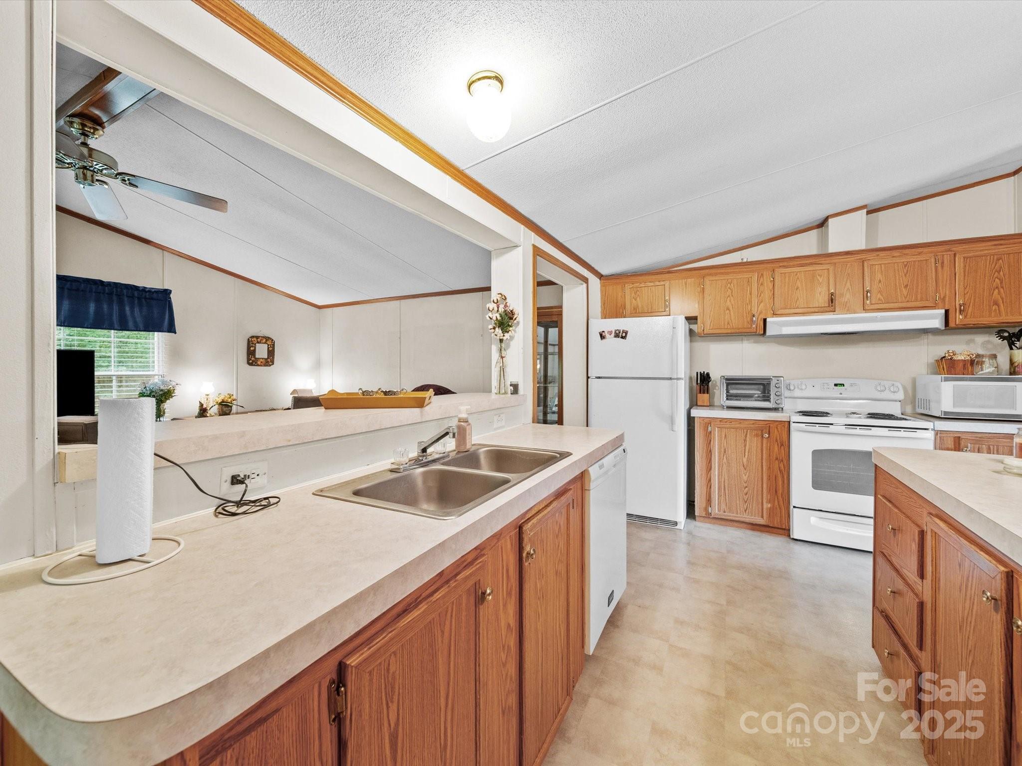 3911 Doster Road Monroe, NC 28112 - Photo 23 of 34 a kitchen with a sink stove and cabinets