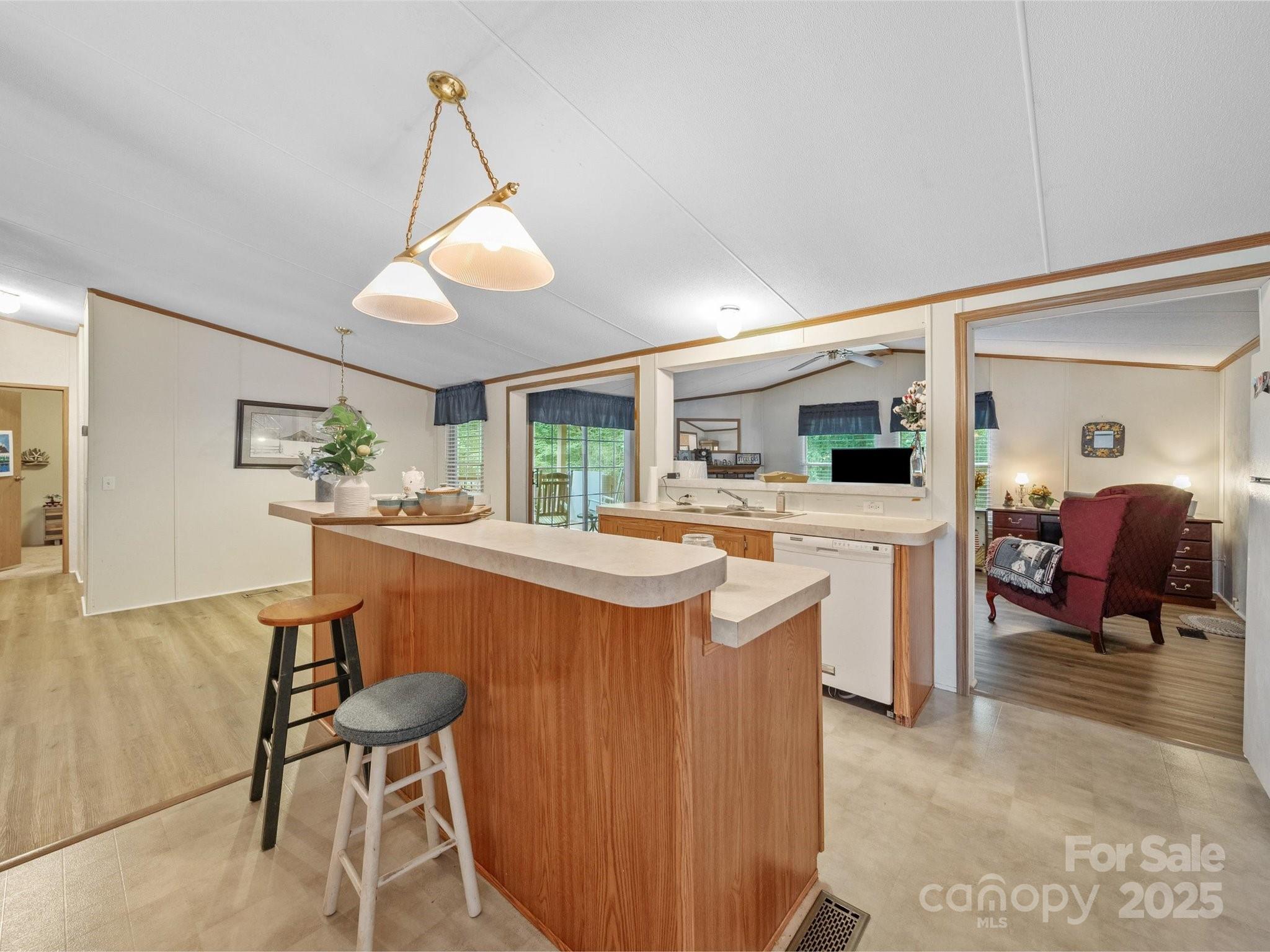 3911 Doster Road Monroe, NC 28112 - Photo 24 of 34 a kitchen with stainless steel appliances kitchen island granite countertop a sink and cabinets
