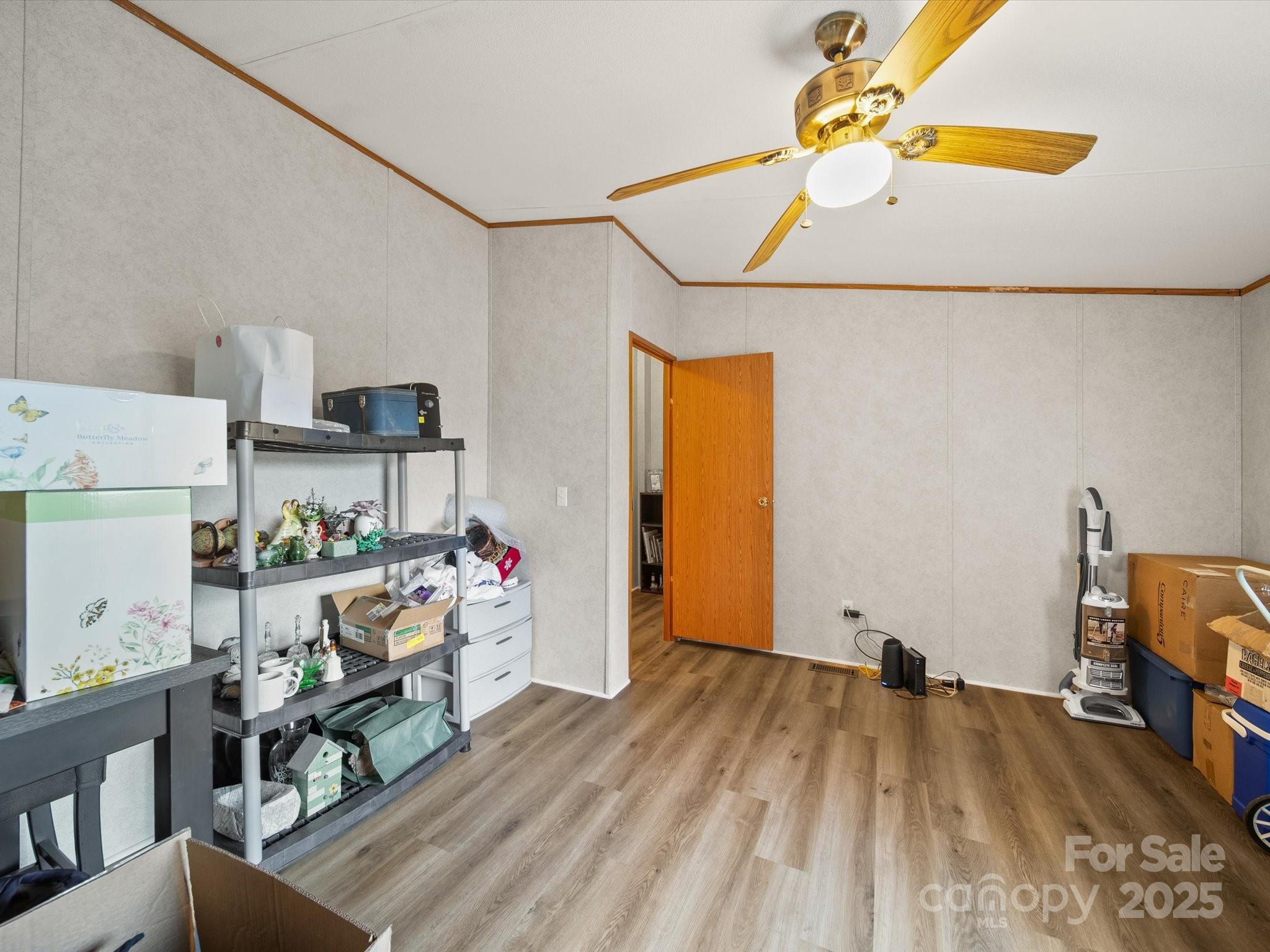 3911 Doster Road Monroe, NC 28112 - Photo 29 of 34 a living room with furniture and a wooden floor